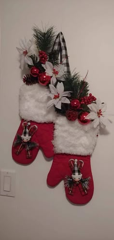 two christmas stockings hanging on the wall