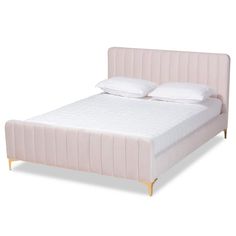 a pink bed with two pillows on top of the headboard and foot board, in front of a white background