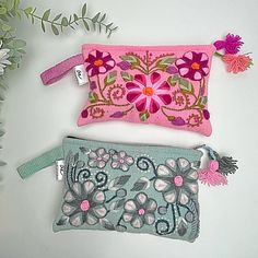 Organize your belongings in this cute, colorful, and convenient pouch. It features amazing floral design embroideries made with colorful alpaca yarn over a handloomed wool pouch. Includes cotton lining, top zipper, and the perfect size wristlet! Details: * Handmade Medium size zip Pouch * Handmade Colorful Floral Embroidery * Measurement: L 5'' x W 8'' * Top zipper closure, with pompom * Wool Wristlet * Handmade in Peru Washing: Avoid washing in machine - dry cleaning or hand washing using cold Embroidered Wool, Embroidery Sampler, Embroidery Bags, Floral Bags, Alpaca Yarn, Embroidered Bag, Recycled Leather, Cosmetic Pouch, Zip Pouch