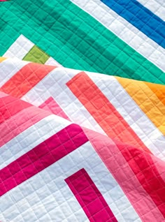 The Zoe Quilt Pattern is a quick, fun project for showing off your favorite fabrics. The pattern works beautifully with a selection of rainbow fabrics, but is also great for working from your stash or using your favorite fabric collection. SizesBaby Size - 45" x 45"Lap Size - 56" x 67"Twin Size - 79" x 90" Skill LevelIntermediate - the trickiest part of this pattern is trimming your quilt. Coloring SheetA coloring sheet for planning your fabrics can be downloaded here. A paper version of the pat Ombre Quilts, Quilts For Men, Solid Fabric Quilts, Twin Quilt Pattern, Modern Quilt Blocks, Bright Quilts, Modern Baby Quilt, Solid Quilt, Spring Quilts