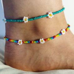 Dainty daisy anklet/ summer anklet/dainty anklet/ rainbow anklet/ rainbow anklet/ trendy jewellery/ cute boho jewellery/ dainty jewelry. Very fragile but beautiful as long as you're careful! Perfect gift for family or friends, or just something for yourself! To measure your anklet size, I suggest taking a piece of string (or a tape measure if you have one) and then measure around your ankle and choose the closest (or slightly larger) option!  If there are any problems please let me know on here or on my Instagram: @lanneaux_jewellery! Handmade Trendy Anklets For Spring, Trendy Handmade Anklets For Spring, Spring Anklets With Colorful Beads, Trendy Multicolor Anklets For Spring, Adjustable White Anklets For Spring, Colorful Beaded Anklets For Spring Gift, Trendy Colorful Beaded Anklets As Gift, Spring Gift Anklets With Colorful Beads, Dainty Colorful Beads Anklets As A Gift