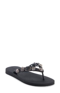 Bring Balenciaga's signature style poolside in this flip-flop detailed with the Cagole line's distinctive hardware detailing the thong straps. Synthetic upper, lining and sole Made in Italy Designer Shoes Designer Leather Flip Flops For Beach, Designer Leather Flip Flops For The Beach, Leather Flip Flops With Buckle Closure For Beach, Beach Flip Flops With Buckle And Single Toe Strap, Designer Black Flip Flops For Beach, Designer Black Flip Flops For The Beach, Adjustable Black Flip Flops With Buckle, Chic Adjustable Toe Post Flip Flops, Adjustable Chic Toe Post Flip Flops