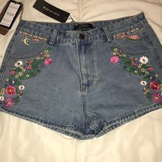 Cute!! Embroidered Jean Shorts New With Tag. European Sizing - Us Juniors Size 10 But Runs A Bit Small. Nonsmoking Home Embroidered High Rise Cotton Bottoms, High Rise Embroidered Cotton Bottoms, Embroidered High-rise Cotton Bottoms, High Rise Summer Bottoms With Floral Embroidery, Summer Mid-rise Pants With Floral Embroidery, Mid-rise Pants With Floral Embroidery For Summer, Mid-rise Floral Embroidery Summer Pants, Summer High Rise Embroidered Bottoms, Casual High Waist Pants With Floral Embroidery