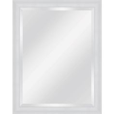 a white framed mirror on a wall