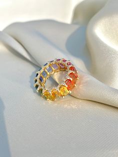 Rainbow Sapphire Ring, 14K Solid Gold, Multicolor Sapphire, Eternity Band Ring, Rainbow Gemstone Ring, Multicolor Band Ring, Gift For Her Diri Jewels 1. Material Details ✧ Gold KT: 14K Solid Gold ✧ Gold Color Options: Yellow Gold, White Gold, Rose Gold ✧ Gemstones: Natural Multi Sapphire (11.00 CTS - final carat weight will depend on ring size) ✧ Natural Diamonds: H-I VS-SI (0.75 CTS - final carat weight will depend on ring size) 2. Shipping & Packaging Details ☐ Dispatches in 4 - 8 business day Luxury Multicolor Cluster Ring As Gift, Multicolor Oval Ring With Prong Setting, Oval Multicolor Ring With Prong Setting, Multicolor Cubic Zirconia Fine Jewelry Ring, Multicolor Cubic Zirconia Diamond Ring For Anniversary, Multicolor Multi-stone Cubic Zirconia Rings, Multicolor Diamond Rings With Prong Setting, Multicolor Halo Rings Fine Jewelry, Multicolor Round Diamond Ring Gift