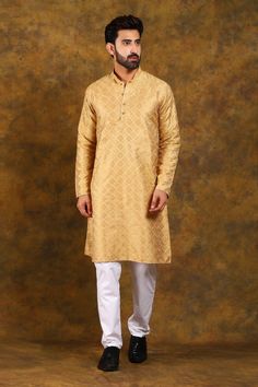 BLUESAANCHI MEN'S GOLDEN EMBROIDERY KURTA SET   The BLUESAANCHI Men's Golden Embroidery Kurta Set is an epitome of elegance and style. Perfect for festive occasions, this traditional outfit is designed to provide comfort with a touch of luxury. Crafted with intricate golden embroidery, this kurta set adds a royal charm to your ethnic wardrobe.  Key Features  Elegant golden embroidery on the kurta  Comes with a matching churidar  Comfortable and breathable fabric  Perfect for festive and special occasions  Available in various sizes   Specifications  Brand: BLUESAANCHI  Color: Golden with embroidery  Style: Kurta Set  Fit: Regular Fit  Available Sizes: S, M, L, XL, XXL   Material & Care  Material: Cotton Silk Blend  Care: Dry Clean Only    Legal Disclaimer:  The product is guaranteed to be Embroidery Kurta, Golden Embroidery, Traditional Outfit, Churidar, Kurta Set, Cotton Silk, Traditional Outfits, Party Wear, Breathable Fabric