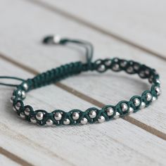 3 mm Rhodium Plated 925 Sterling Silver BeadsAdjustable Length (14 cm to 23 cm)Cord Color: Dark Green Adjustable Green Beaded Bracelet Minimalist Style, Adjustable Green Beaded Bracelets Minimalist Style, Green Adjustable Beaded Bracelets Minimalist Style, Minimalist Green Beaded Bracelets With Tiny Beads, Minimalist Green Beaded Bracelet With Tiny Beads, Minimalist Adjustable Green Bracelets, Handmade Silver Beaded Casual Bracelets, Handmade Silver Beaded Bracelets Casual Style, Handmade Minimalist Green Beaded Bracelets