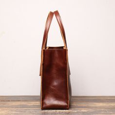 Features Vintage full grain leather L 13" x W 3.9"xH 8.6" About 1.5 Ibs Two carrying handles Multiple accessory and organizer pockets Adjustable/removable shoulder strap Minimalist Leather Tote, Work Handbag, Over The Shoulder Bags, Leather Handbags Women, Vintage Women, Women Leather, Tote Purse, Stylish Bag, Vintage Handbags