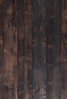 an old wooden wall with peeling paint and wood grains on the bottom part of it