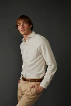 Introducing the Woven Oxford Shirt in Tan and Off White - a timeless and versatile addition to any wardrobe. Crafted using 100% organic cotton fabric, this shirt is lightweight and breathable, ensuring maximum comfort throughout the day. The subtle tan hue with off-white gives it a classic and sophisticated textural look, while the imitation mother-of-pearl buttons lend a touch of luxury to the overall design. This shirt has been exquisitely crafted to ensure a comfortable fit, making it perfect Timeless Cotton Tops For Spring, Classic Neutral Shirt For Work, Classic Neutral Shirt For Workwear, Beige Button-up Shirt For Casual Gatherings, Beige Relaxed Fit Cotton Shirt, Classic Neutral Linen Shirt, Classic Neutral Workwear Shirt, Relaxed Fit Beige Cotton Shirt, Beige Relaxed Fit Shirt For Casual Gatherings