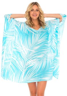 Having a stylish beach cover up is a must! The beautifully printed tunic beach coverup creates a vibrant look. Easy to pull on and easy to pack. Making clothes for the traveling woman. Boho design Lightweight beach dress Semi-Sheer Hand wash in cold water, hang to dry Blue Flowy Breezy Cover-up, Blue Breezy Flowy Cover-up, Beachy Printed Pool Cover-up, Turquoise V-neck Swimwear For Vacation, Green V-neck Tunic For Beach, Long Sleeve Pool Cover-up For Beachwear, Long Sleeve Cover-up For Pool And Beach Season, Long Sleeve Beachwear Cover-up For Pool, Long Sleeve Beachwear Cover-up