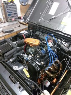 the engine compartment of a car with its hood open