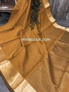 Solid ochre color sheer saree with Banarsi gold border . Mix and match with different blouses and accessories!! Soft cotton silk plain saree with a zari border palla. -Fall attached -Blouse fabric included Traditional Gold Chanderi Dupatta, Gold Chanderi Dupatta In Traditional Drape, Gold Chanderi Dupatta With Traditional Drape, Gold Art Silk Blouse Piece With Self Design, Gold Chanderi Dupatta For Eid, Gold Chanderi Dupatta For Diwali, Brown Raw Silk Dupatta With Zari Work, Gold Semi-stitched Blouse Piece With Self Design, Gold Tissue Silk Dupatta For Festivals