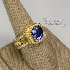 This 18k solid gold Vintage Ring has a eye catching blue sapphire as its center piece. The sapphire ring has a very unique band set with diamonds and multiple layers of diamonds.This ring has a GIA certificate.Ring Size: 8.75Total Weight: 18.53 gramsPrecious Metal: 18k solid goldPrecious stones:-Blue Sapphire heat only Center Stone: 4 carats, 11mm x 10.3mm-White Round and Square Diamonds: 1.38 carats Gold Tanzanite Diamond Ring Fine Jewelry, Gold Tanzanite Ring With Halo Setting, Sapphire Ring In Yellow Gold With Halo Setting, Luxury Jewelry With Halo Setting And Lab-created Sapphire, Yellow Gold Tanzanite Diamond Ring With Halo Setting, Yellow Gold Tanzanite Diamond Ring With Accent Stones, Luxury Halo-set Lab-created Sapphire Jewelry, Yellow Gold Sapphire Jewelry With Halo Setting, Unique Yellow Gold Sapphire Ring