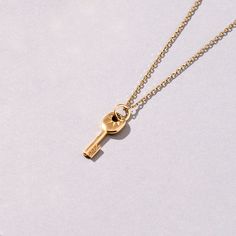 This Key Pendant is the perfect accessory for any fashion-forward individual. Its simplicity and elegance make it an ideal piece for everyday wear, as well as for special occasions. With its classic yet contemporary look, it is sure to be a treasured pieces in any jewelry collection. - Made in 14k solid gold - Pendant: 16.90x6.50 mm / 0.66x0.26 inches - Pendant Thickness: 1.35 mm / 0.053 inches - This product comes with iconic Norm Jewels gift box - This price is for pendant only, the chain is s Gold Key Necklace, Gold Knot Ring, Small Pendants, Eternity Ring Gold, Paper Ring, Gold Key, Rose Gold Pendant, Locket Charms, Key Necklace