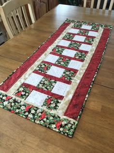 the table runner is made with red and green fabric