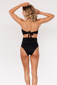 Baltic Born exclusive style Pairs with our Milos High Waist Bikini Bottom in Black Classic black color Tie back bandeau style bikini top Removable padded cups Adjustable to fit most body types 80% Nylon, 20% Spandex Hand wash cold, lay flat to dry Trina is 5'6, cup size 32D, size 2 and is wearing size S Victoria is 5'7, cup size 34D, size 8/10 and wearing size L Sierra is 5’8, cup size 37”, size 6/8 and wearing size L Bandeau Swimwear With Built-in Bra For Sunbathing, Bandeau Swimwear With Padded Cups For Poolside, Bandeau Swimwear With Padded Cups For Sunbathing, Bandeau Swimwear With Removable Bra Pads For Poolside, Bandeau Swimwear With Removable Bra Pads For Sunbathing, Padded Fitted Strapless Swimwear, Fitted Padded Strapless Swimwear, Strapless Padded Fitted Swimwear, Black Triangle Top Swimwear With Padded Cups