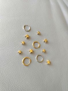 18K gold plated stainless steel, stainless steel. Star charm measures 9 mm x 9 mm. More earrings  https://www.etsy.com/shop/CornerByZ?ref=seller-platform-mcnav If you have any questions, please feel free to contact me. Everyday Jewelry With Star Charm, Gold Huggie Nose Rings Nickel Free, Small Gold Sterling Silver Huggie Earrings, Dainty Gold Huggie Piercings, Nickel Free Gold Huggie Nose Rings, Nickel Free Gold Huggie Piercings, Gold Huggie Piercings Nickel Free, Gold Septum Ring Tarnish Resistant As A Gift, Dainty Gold Septum Ring For Everyday