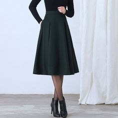 "More color: https://etsy.me/3NgO20M ★★ FEATURES * Wool skirt * Polyester lining * Two side seam pockets * Right zipper closure * pleated detail * Plus size full skirt * A Line Skirt * Perfect for Winter, autumn, spring * Dry clean ★★ The model is 170 cm (5′ 7″) tall with a 80 cm (31.5\") bust, 66 cm (26\") waist. She is wearing the green wool skirt in size XS. ★★ Bespoke Order Service If you Request other color Request the length Your height is not between 155 cm- 172 cm Your weight is over 75 Chic A-line Winter Skirt, Fitted Denim Skirt For Winter, Winter Solid Pleated Skirt, Elegant Solid Pleated Skirt For Winter, Winter Wool A-line Skirt, Fitted A-line Skirt For Winter, Winter Pleated Solid Color Skirt, Winter Knee-length Lined Pleated Skirt, Winter Solid Color Pleated Skirt