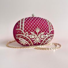 A timeless and classic piece, handcrafted with detailed embroidery and pearl beads. The maroon tones and gold threaded embroidery adds a luxurious feel to the bag and brings the statement factor to your look. With one main compartment and a magnetic fastening, this grande clutch is completed with a chain strap which can be worn as a shoulder bag or tucked in for a clutch style. Wedding Bags, Detailed Embroidery, Wedding Bag, Accessories Bags Purses, Gold Threads, Bags Purses, Beautiful Bags, Pearl Beads, Chain Strap