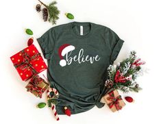 "Believe Christmas Shirt, Christmas Believe Shirt Christmas Party Shirt Christmas T-Shirt, Christmas Family Shirt, Believe Shirt, Xmas  Gift 📢Please Check All Photos For Details. 📢Choose Your T-Shirt Size From The Drop-Down Lists Next To The item Picture   📢Choose Of Your T-Shirt Color From The 2nd Picture   📢Use \"Add message to Seller\" link On The Checkout Page To Send me the Following important Details For Your Order's Customization.   📢Shipping Time Varies by location (we are located i Rottweiler Christmas, Cool Mom Shirts, Gifts For New Grandma, Nana Christmas Gifts, Santas Favorite Ho, Nana T Shirts, Nana Shirts, Christmas Party Shirts, New Grandma