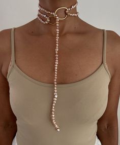 ** Pearl Necklace loops through Ring and can be wrapped once or multiple times. PEARLS are symbolic of wisdom gained through experience. The gems are believed to offer protection, as well as attract good luck and wealth. They are well-known for their calming effects. Pearls have a way of bringing balance to your karma, bring illumination, enlightenment, and insights on a mental level. Pearls symbolize purity and is known as a “stone of sincerity”. It brings truth to situations and loyalty to a “ Unique Handmade Pearl Jewelry, Handmade Unique Pearl Jewelry, Elegant Natural Stones Jewelry For Meditation, Elegant Wire Wrapped Jewelry For Meditation, Elegant Natural Stone Jewelry For Meditation, Gold Amulet Style Hand Wrapped Necklace, Gold Amulet Necklace Hand Wrapped, Unique Pearl Jewelry As A Gift, Hand Wrapped Lariat Necklaces For Gifts