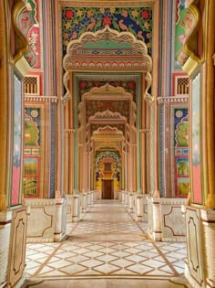 an ornate hallway with painted walls and columns