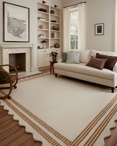 a living room filled with furniture and a fire place