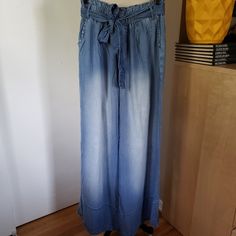 Beautiful & Flowy Lightweight Wide Leg Denim Pants With Belt! Brand: Zenana Color: Faded Blue Size: Large Cut: Wide Leg/Straight Leg Design/Details: Paperbag Style Waist With Elastic Lightweight Denim Pants. Wide Leg And 100% Lyocell. Side Pockets And Removable Belt. Condition: New Without Tags (Nwot) Waist: 14 Length: 43 All Pics Shown Are Of The Actual Item. Please Review Carefully For Additional Listed & Unlisted Details. Smoke Free Home Pet Free Home Bundle And Save On Shipping! Please Visit Washed Denim Full-length Pants, Summer Washed Blue Jeans With Elastic Waistband, High Waist Elastic Jeans In Medium Wash, Full-length Washed Denim Pants, Summer Jeans With Elastic Waistband In Washed Blue, High Waist Jeans With Elastic Waistband In Medium Wash, High Waist Medium Wash Jeans With Elastic Waistband, High Waist Jeans With Elastic Band In Medium Wash, Medium Wash Wide Leg Jeans For Day Out