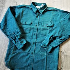 "Vintage 70s 80s Five Brother Chamois Flannel Shirt. Shirt is in good vintage condition.  There is a small hole on the seam of the left cuff closure.  Also, some discoloration wear down the front.  See pictures for details.  100%  Cotton.  Double Chest Pockets. Green.  Made in U.S.A. Size Extra Large Pit to pit:  26.75\" Length (collars seam to hem):  30\" Shoulder to shoulder:  20.5\" Shoulder seam to cuff:  25\"" Vintage Cotton Flannel Shirt With Button Closure, Vintage Cotton Shirt For Winter, Vintage Cotton Flannel Shirt For Winter, Vintage Green Cotton Flannel Shirt, Vintage Long Sleeve Flannel Shirt, Mens Oxfords, Flannel Shirt, Vintage 70s, Extra Large