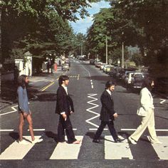 the beatles are walking across the street