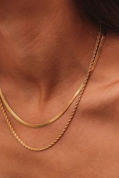 *FINAL SALE Length: 44+5cmHerringbone Chain Width: 4mmRope Chain Width: 2mm 18k Gold PlatedStainless SteelWaterproofTarnish-ResistantLead & Nickel Free The classic Freya 18k Gold Plated Herringbone Layered Rope Chain Necklace is perfect for any occasion. This delicate layered design makes this necklace a minimal, effortless accessory that you can wear beach to bar. All orders will be packaged in our signature cotton pouch, great for gifting or keeping your jewels safe while traveling!ISOLA JEWEL Gold Jewels Design, Cotton Pouch, Rope Chain Necklace, Layered Design, Rope Chain, Layers Design, Layered Necklaces, Jewelry Care, Herringbone