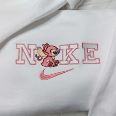 Angel Stitch Nike Embroidered Sweatshirt, Lilo & Stitch Embroidered Hoodie, Custom Nike Logo Shirt Our clothing store offers a unique selection of embroidered sweatshirts, t-shirts, and hoodies that are perfect for any occasion. Our Angel Stitch Nike embroidered sweatshirt is a standout piece that combines the iconic Nike brand with a playful touch of the beloved Disney character, Angel. The embroidery is skillfully crafted and adds dimension and texture to the sweatshirt, making it a statem White Hooded Top With Machine Embroidery, Cute White Embroidered Hoodie, White Embroidered Hooded Hoodie, Cute Embroidered Long Sleeve Hoodie, Luffy Nike, One Piece Nike, Lilo And Stitch Hoodie, Nike Embroidered Sweatshirt, Stitch Nike