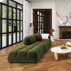 a living room filled with furniture next to a fire place and large glass door windows