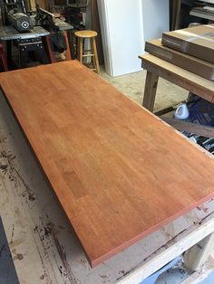 a wooden table being worked on in a shop