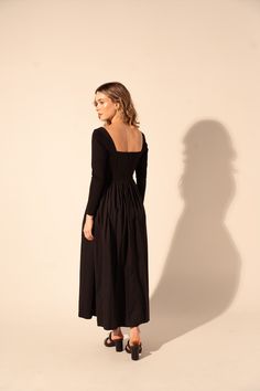 Expertly crafted for timeless elegance, the Galilea Dress in Black features a long sleeve and fitted top for a flattering silhouette. The square neckline adds a touch of sophistication while the full skirt and midi length offer versatile styling options for any occasion. Elevate your wardrobe with this must-have dress. The design process of Kleid is magic! Childhood best friends carefully review each detail to remain truthful to the reasons why they decided to embark in the adventure of reinvent Magic Childhood, Childhood Best Friends, Pre Fall Collection, Daytime Dresses, Black Features, Fitted Top, Shoe Gifts, Vacation Style, Vacation Dresses