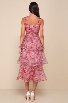 Everyone will be wowed when you walk in wearing the Lulus Dramatic Glamour Mauve Floral Organza Tiered Midi Dress! Airy woven organza boasts a moody floral print as it shapes wide tank straps and a square neckline. Banded waist boasts chic gathered details, atop a voluminous tiered skirt that falls to a long midi hem. Hidden zipper/clasp at side. Fit: This garment runs small - please size up. Length: Mid-calf length. Size medium measures 50.5" from shoulder to hem. Bust: Works best for A to C cu Silk Floral Print Dress For Wedding Guest, Chic Organza Dress For Garden Party, Feminine Pink Organza Midi Dress, Spring Floral Print Organza Dress, Feminine Floral Print Organza Dress, Organza Floral Print Garden Party Dress, Elegant Floral Ruffle Dress For Evening, Floral Print Organza Dresses For Garden Party, Tiered Organza Dress For Garden Party