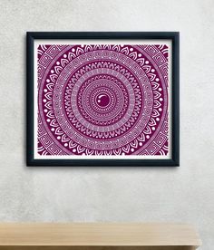 a purple and white art print hanging on a wall