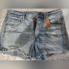 New American Eagle Lite Blue Denim, Button Front, Maybe Tastfully Worn Unbuttoned Denim Blue Jean Shorts With Buttons, Buttoned Denim Jean Shorts, Summer Washed Blue Bottoms With Button Closure, Washed Blue Denim Bottoms With Buttons, Cutoff Denim Jean Shorts With Buttons, Cutoff Jean Shorts With Button Closure In Medium Wash, Medium Wash Casual Shorts With Button Zip Fly, Casual Medium Wash Shorts With Button Zip Fly, High Rise Medium Wash Jean Shorts With Button Closure