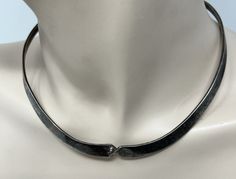 "BEAUTIFUL Vintage 925 Silver Twisted Cuff Collar Choker Necklace This has a twist design in the center Adjustable 3/8\" wide tappers down to 3/16\" Weighs 32g Stamped 925 And tested Sold as found with natural patina This will need a good polish Elevate your style with this vintage 925 silver twisted cuff collar choker necklace. The intricate design and timeless appeal make it an ideal addition to any jewelry collection. The collar style provides a unique twist on the traditional necklace, while the twisted design adds a touch of elegance. Crafted with 925 silver, this necklace boasts a high level of purity and quality. The vintage design is perfect for those who appreciate classic style and timeless beauty. Whether you're dressing up for a special occasion or adding a touch of sophisticat Traditional Necklace, Collar Choker, Choker Collar, Choker Necklaces, Intricate Design, High Level, The Vintage, Vintage Design, Timeless Beauty