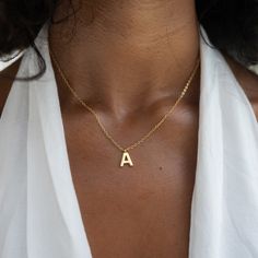 P R O D U C T I N F O R M A T I O N  ⭐Material Quality » Crafted from high-quality 925 sterling silver and gold-plated, this stainless steel women's chain offers durability and lasting shine. The stainless steel chain for women guarantees skin-friendliness and comfort, ideal for daily wear. Our gold letter necklace is sturdy and features a lobster clasp closure. Our women's gold chain is waterproof. The initial necklace features the letter "A".  ⭐Unique Pendant » The letter pendant with the lett Classic Letter Jewelry For Gifts, Tiny Initial Pendant Necklace For Gift, Dainty Initial Necklace In Yellow Gold For Birthday, Simple Gold Sterling Silver Initial Necklace, Simple Gold-toned Sterling Silver Initial Necklace, Simple Gold-colored Sterling Silver Initial Necklace, Everyday Personalized Tan Jewelry, Gold Sterling Silver Initial Necklace For Birthday, Tarnish Resistant Initial Necklace For Mother's Day