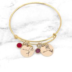 "Birth Flower Bracelet * Birthstone Bracelet * Birth Month Flower Bracelet * Personalized Birth Flower Bracelet * Gift For Mom Have this bangle bracelet personalized with the birth flower(s) and birthstone(s) of your choice! Personalized jewelry makes the perfect gift for so many occasions. Each charm measures 5/8\" which makes this bracelet dainty and simple, yet full of personal meaning! It is also adorned with a beautiful birthstone. » The bracelets are made with sterling silver, gold-filled Adjustable Bracelet With Flower Charm, Adjustable Flower Crystal Bracelet Gift, Adjustable Flower Charm Bracelet, Friendship Flower Charm Bracelets, Adjustable Crystal Bracelet With Flower Charm, Flower-shaped Bracelets With Charms For Gift, Adjustable Flower-shaped Charm Bracelets, Adjustable Flower-shaped Bracelets With Charms, Adjustable Flower Charms Bracelets