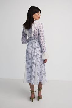 Long sleeve with ruffle details on arms and the frontHas contrasting pleatsRuns small, no stretch in waistbandModel wears size XSModel is 172cm/5'8" with 25 waist, 32 bust, 34 hips 80% Chiffon 20% PolyesterDry clean onlyMade in Armenia Polka Dot Long Sleeve Chiffon Dress, Polka Dot V-neck Dress With Ruffle Hem, Dot Dress, Polka Dot Dress, Ruffles, Polka Dots, Chiffon, Long Sleeve Dress, White