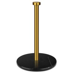 a black and gold table with a metal pole on it's base, in front of a white background