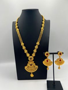 Embrace regal elegance with our exquisite 24K gold-plated Rani Haar set, a true masterpiece designed for the modern queen. This luxurious jewelry set, inspired by traditional royal designs, is perfect for weddings, special occasions, or adding a touch of grandeur to your collection. Care Instructions: To maintain the pristine condition of your Rani Haar set, avoid direct contact with water, perfumes, and harsh chemicals. Store in a dry, cool place when not in use. Luxury Gold Plated Jewelry For Puja, Gold Meenakari Temple Jewelry Sets, Bollywood Style 22k Gold Jewelry Set, Heavy 22k Yellow Gold Jewelry Sets, Gold Temple Jewelry Set, Gold Sets For Formal Diwali Occasion, Gold Formal Sets For Diwali, Elegant Gold Kundan Bridal Necklace, Formal Gold Kundan Jewelry Sets