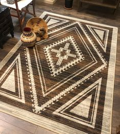 a brown and white area rug with a cat on it's side sitting on the floor