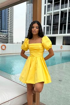 A delicate midi-length dress with the most feminine "godet" silhouette skirt in Yellow. Drapery on the bodice line is designed to ensure your look to be joyful and romantic. The garment has a fitted cut and puffy sleeves. The dress favorably emphasizes the silhouette, tightly fitting the hips, expanding to the bottom. The dress will make you feel the prettiest and good looking ever. Feminine A-line Puff Sleeve Dress For Cocktail, Flirty Fitted Puff Sleeve Dress With Gathered Sleeves, Fitted A-line Puff Sleeve Dress With Ruffles, Fitted Bodice Mini Dress With Gathered Sleeves, Feminine Puff Sleeve Dress With Gathered Sleeves For Cocktail, Flirty Fitted Knee-length Puff Sleeve Dress, Knee-length Mini Dress With Gathered Sleeves, Flirty Dresses With Gathered Short Sleeves, Fitted Mini Dress With Gathered Sleeves