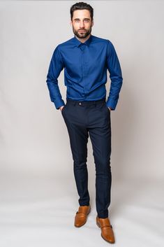 Look effortlessly smart for all every occasion in this blue Carter shirt. This wardrobe staple is cut to a classic fit with long sleeves and spread collar. Keep it formal by wearing alongside your three piece suit, or make it casual by rolling up the sleeves and paring with chinos or jeans. Model wears size M shirt and the Max navy trousers. Features Classic fit Spread collar Single cuff Long sleeve Plain fabric Cufflink holes Style Tip | ﻿Wear with a style that has navy detailing like the Scott Blue Slim Fit Dress Shirt, Blue Slim Fit Shirt For Office, Formal Blue Dress Shirt With Long Sleeves, Business Casual Shirt With Lapel Collar And Welt Pockets, Blue Slim Fit Shirt For Semi-formal Occasions, Elegant Tailored Blue Dress Shirt, Blue Long Sleeve Dress Shirt For Office, Blue Shirt With Lapel Collar For Work, Blue Lapel Collar Shirt For Work