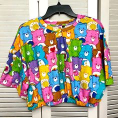 Women’s Care Bears Crop Top With Elastic Bottom. Never Worn, No Tags Fun Pink Tops For Loungewear, Cute Multicolor Loungewear Tops, Cute Multicolor Tops For Loungewear, Playful Multicolor Tops For Loungewear, Cute Multicolor Tops For Vacation, Cute Multicolor Vacation Tops, Cute Multicolor Tops With Rainbow Print, Trendy Pink Top With Rainbow Print, Multicolor Cartoon Print Beach Tops