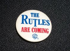 a button that says the ruttles are coming on a black surface with red, white and blue lettering